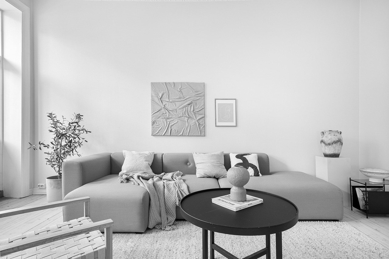 Bright living room with framed artwork hanging above a sofa