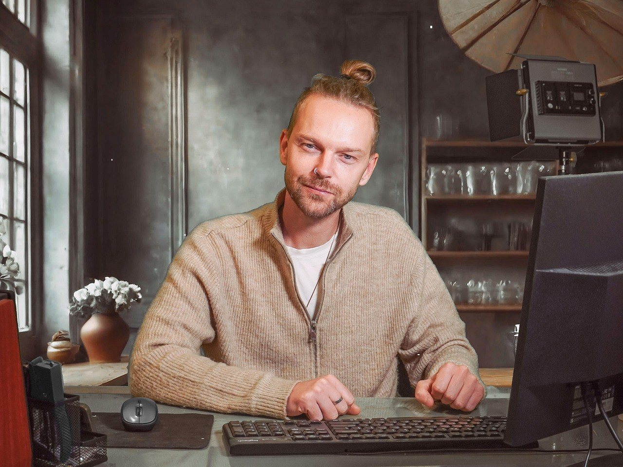 Illustrator working at a desk with a computer