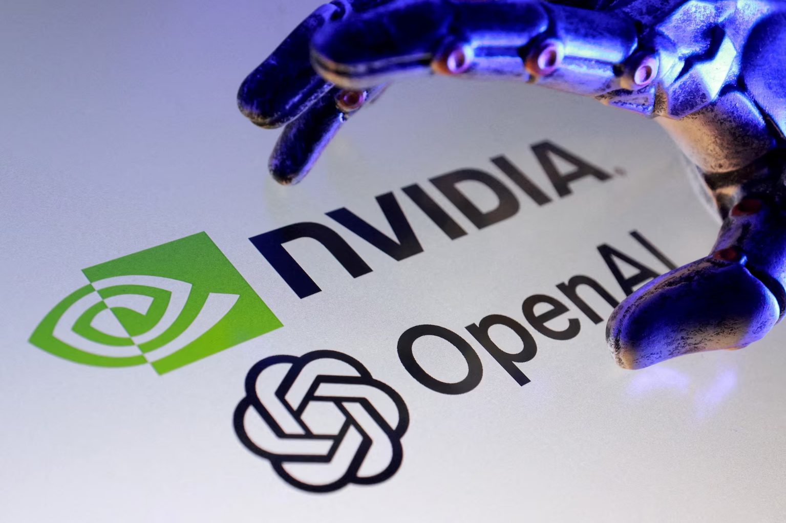 NVIDIA and OpenAI logos with a robotic hand above them