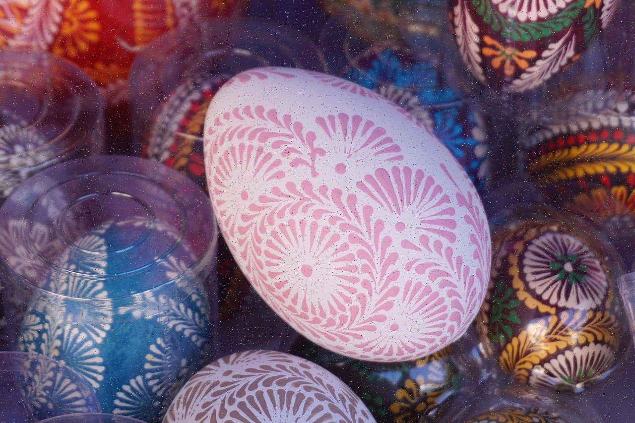Hand-painted eggs with bold patterns in saturated reds, blues and yellows